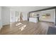 Spacious living room provides an open floorplan, new flooring, fresh paint, and access to the kitchen at 1524 Twin Sisters Dr, Longmont, CO 80504