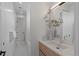 Modern bathroom featuring a bright vanity, walk-in shower and stylish neutral decor at 735 S Elizabeth St, Denver, CO 80209