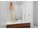 Bright bathroom with modern vanity, white backsplash, stylish pendant lighting, and decorative accents at 735 S Elizabeth St, Denver, CO 80209