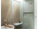 Modern bathroom featuring a soaking tub, walk-in shower, skylight, and sleek tile work at 735 S Elizabeth St, Denver, CO 80209