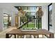 Dining room featuring modern decor, staircase with glass partitions and hardwood floors at 735 S Elizabeth St, Denver, CO 80209