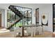 Dining room featuring modern decor, staircase with glass partitions and hardwood floors at 735 S Elizabeth St, Denver, CO 80209