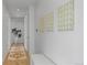 Bright hallway featuring modern art, hardwood floors, and a neutral color scheme at 735 S Elizabeth St, Denver, CO 80209