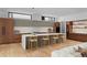 Open-concept kitchen with a large island, wood cabinets, and barstool seating at 735 S Elizabeth St, Denver, CO 80209