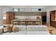 Modern kitchen with a large island, stylish chairs, and wood-grain cabinets at 735 S Elizabeth St, Denver, CO 80209