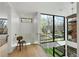 Upstairs landing with large windows providing natural light and outdoor views at 735 S Elizabeth St, Denver, CO 80209