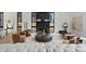 Modern living room area with black marble fireplace, hardwood floors and light neutral decor at 735 S Elizabeth St, Denver, CO 80209