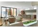 Open-concept living room with modern decor, hardwood floors and an abundance of natural light at 735 S Elizabeth St, Denver, CO 80209
