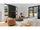 Bright living room featuring hardwood floors, designer furniture, and modern fireplace at 735 S Elizabeth St, Denver, CO 80209