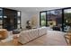 Open concept living room featuring a fireplace, modern furniture, and access to outdoor space at 735 S Elizabeth St, Denver, CO 80209