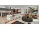 Spacious, open-concept living room featuring an adjacent, modern kitchen at 735 S Elizabeth St, Denver, CO 80209