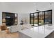 Bright living room with a fireplace, hardwood floors, and sliding glass doors to the backyard at 735 S Elizabeth St, Denver, CO 80209