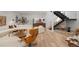 Expansive living room with sleek hardwood floors, modern furniture and stylish staircase at 735 S Elizabeth St, Denver, CO 80209