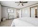 Relaxing main bedroom with ceiling fan, carpeted floor, and decorative elements at 62681 E Hampden Pl, Byers, CO 80103