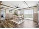 Relaxing dining room features wainscoting, stylish light fixtures, and sliding door access to the backyard at 62681 E Hampden Pl, Byers, CO 80103