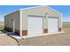 Front exterior of detached garage featuring two-car access at 62681 E Hampden Pl, Byers, CO 80103