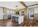 Well-equipped kitchen with island seating, updated appliances, and plenty of cabinet space at 62681 E Hampden Pl, Byers, CO 80103