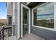 Balcony door with a view of the entryway and a window that provides natural light at 2736 W 68Th Ave, Denver, CO 80221