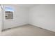 Bright bedroom featuring neutral carpet, white walls and trim, and a window providing natural light at 2736 W 68Th Ave, Denver, CO 80221