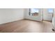 Bright bedroom with wood floors, white walls and large windows at 2736 W 68Th Ave, Denver, CO 80221
