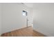 Empty bedroom with hardwood floors, and a doorway that provides natural light at 2736 W 68Th Ave, Denver, CO 80221