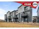 Attractive townhouse exterior with gray siding, black accents and individual small balconies at 2736 W 68Th Ave, Denver, CO 80221
