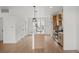 Bright, open kitchen featuring a large island, stainless appliances, and light wood floors at 2736 W 68Th Ave, Denver, CO 80221