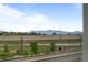 Scenic view of the mountains with a nearby highway and railroad tracks at 2736 W 68Th Ave, Denver, CO 80221