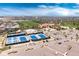 Aerial view of community, featuring a clubhouse, swimming pool, tennis courts, and ample parking at 8255 S Vandriver Way, Aurora, CO 80016