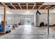 Unfinished basement with painted walls and visible ceiling beams at 8255 S Vandriver Way, Aurora, CO 80016