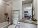 Well-lit bathroom with a shower, tub, toilet and sink with granite countertop at 8255 S Vandriver Way, Aurora, CO 80016