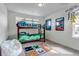 Fun bedroom with bunk beds, playful decor and large windows with views at 8255 S Vandriver Way, Aurora, CO 80016