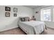 Cozy bedroom with carpeted floors, light walls, and framed decor adding a personal touch at 8255 S Vandriver Way, Aurora, CO 80016