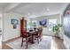 Bright and spacious dining room with hardwood floors and abundant natural light at 8255 S Vandriver Way, Aurora, CO 80016