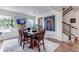 Elegant dining room featuring a large wooden table and stylish decor at 8255 S Vandriver Way, Aurora, CO 80016