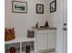 Stylish entryway with bench seating, storage cabinets, and decorative accents at 8255 S Vandriver Way, Aurora, CO 80016