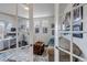 Bright home office with glass French doors, offering both privacy and an open feel at 8255 S Vandriver Way, Aurora, CO 80016