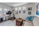 Modern home office with ample natural light, dual monitors, and stylish decor at 8255 S Vandriver Way, Aurora, CO 80016