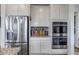 Close-up of the kitchen showcasing stainless steel appliances and ample cabinet space at 8255 S Vandriver Way, Aurora, CO 80016