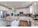 Spacious kitchen showcases granite counters, stainless steel appliances, and center island at 8255 S Vandriver Way, Aurora, CO 80016