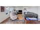 Comfortable living room with hardwood floors, a fireplace, and lots of natural light at 8255 S Vandriver Way, Aurora, CO 80016
