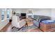 Cozy living room features a fireplace, plush seating, and a colorful area rug at 8255 S Vandriver Way, Aurora, CO 80016