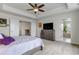 Spacious main bedroom boasts a tray ceiling and an en suite bathroom, plus walk-in closet at 8255 S Vandriver Way, Aurora, CO 80016