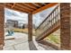 Covered outdoor patio with brick columns, stairs, and seating, perfect for enjoying the outdoors at 8255 S Vandriver Way, Aurora, CO 80016
