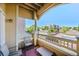 Private balcony with seating, offering a relaxing outdoor space with views of the surrounding community at 9622 W Coco Cir # 203, Littleton, CO 80128