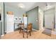 Cozy dining area with laminate flooring and neutral walls perfect for Gathering meals and entertaining at 9622 W Coco Cir # 203, Littleton, CO 80128