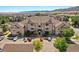 Apartment homes with manicured lawns and mature trees showcasing a well maintained community and mountain views at 9622 W Coco Cir # 203, Littleton, CO 80128