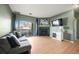 Inviting living room features a cozy fireplace and a sliding glass door to the balcony at 9622 W Coco Cir # 203, Littleton, CO 80128