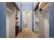 Large walk-in closet offers ample storage space, shelving, and natural light at 9622 W Coco Cir # 203, Littleton, CO 80128