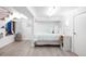 Cozy bedroom with a neutral color scheme, featuring wood floors, a window, and minimalist decor at 1718 W 33Rd Ave, Denver, CO 80211